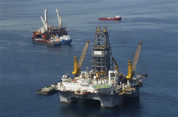 The Development Driller III, which is drilling the primary relief well, and the Helix Q4000, background left, the vessel being used to perform the static kill operation, are scene Aug. 3 at the site of the Deepwater Horizon oil spill in Gulf of Mexico. 